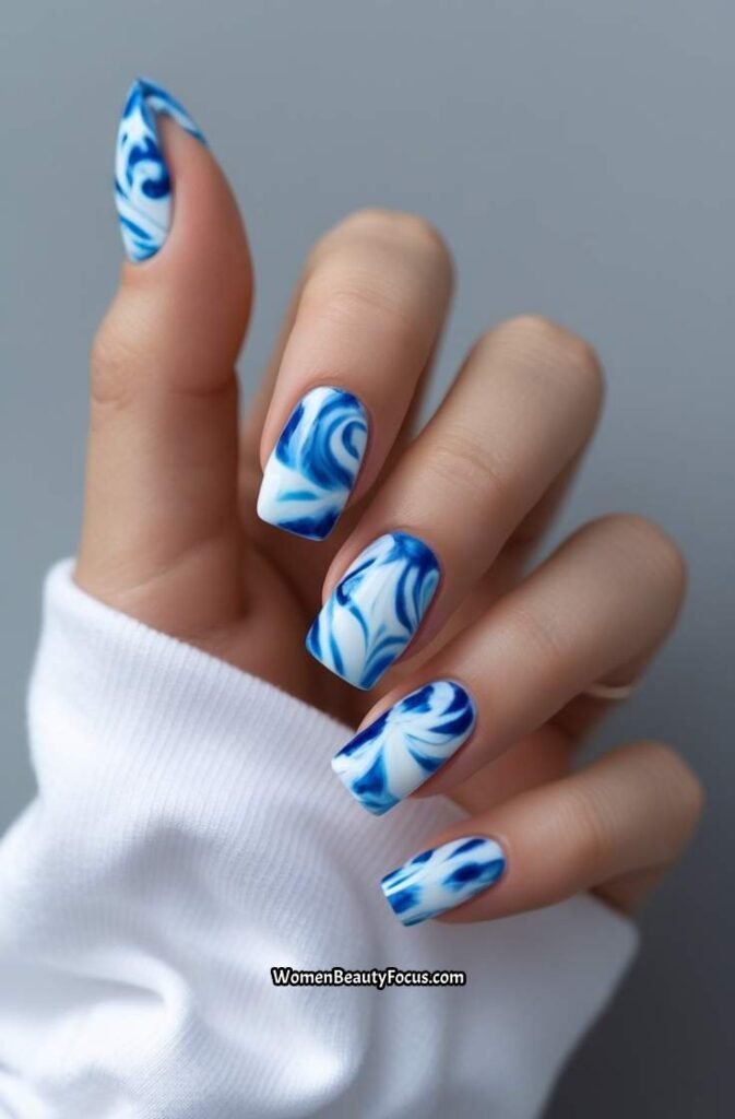 18. Blue Tie Dye Nails