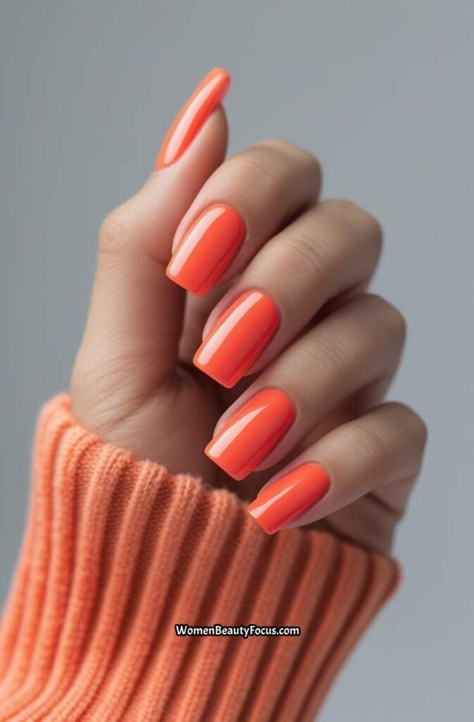 18. Bright Coral Square Nails with Glossy Finish