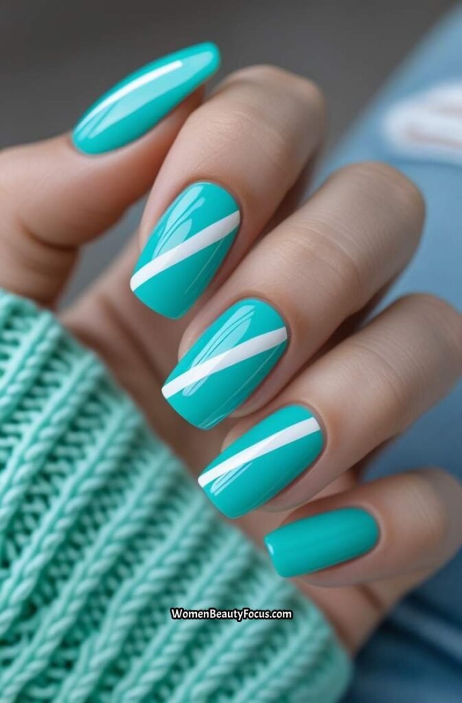 18. Bright Turquoise Nails with White Stripes