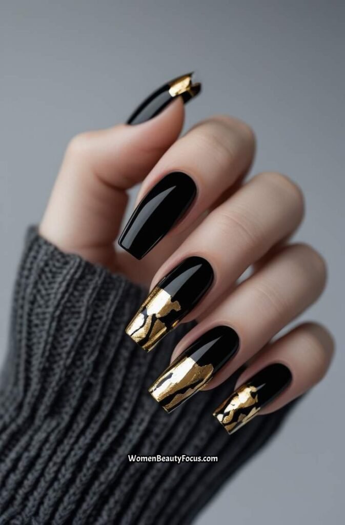 18. Glossy Black Nails with Gold Foil Tips