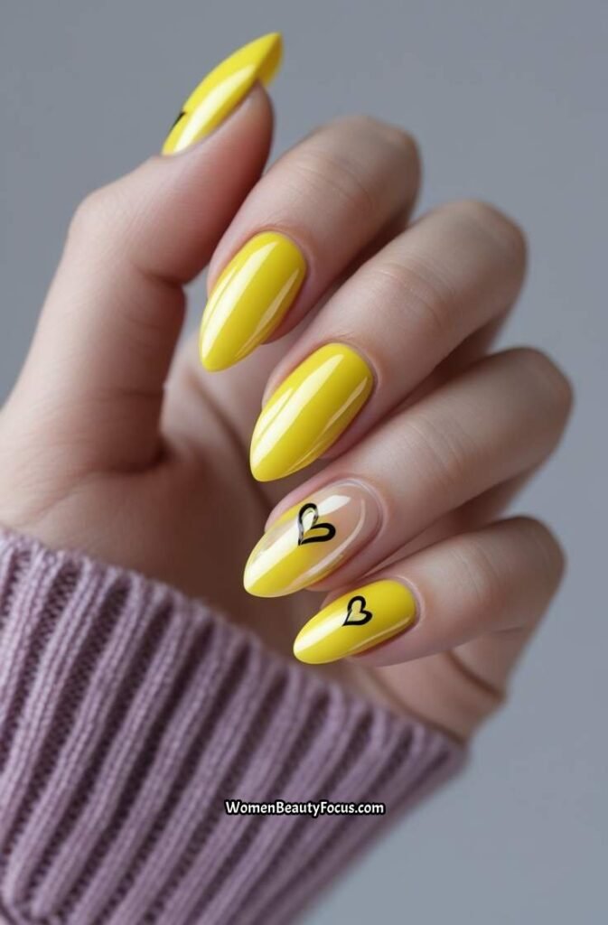 18. Glossy Yellow Chrome Nails with Heart Designs