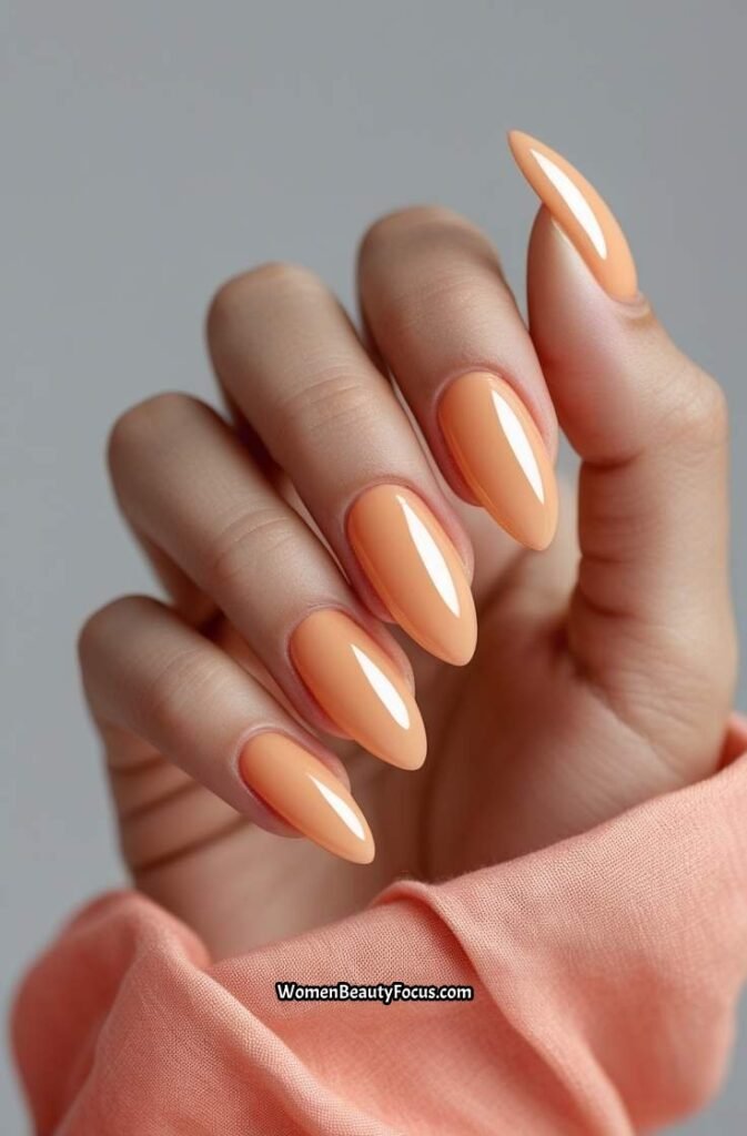 18. Soft Apricot Almond Nails with Glossy Coat