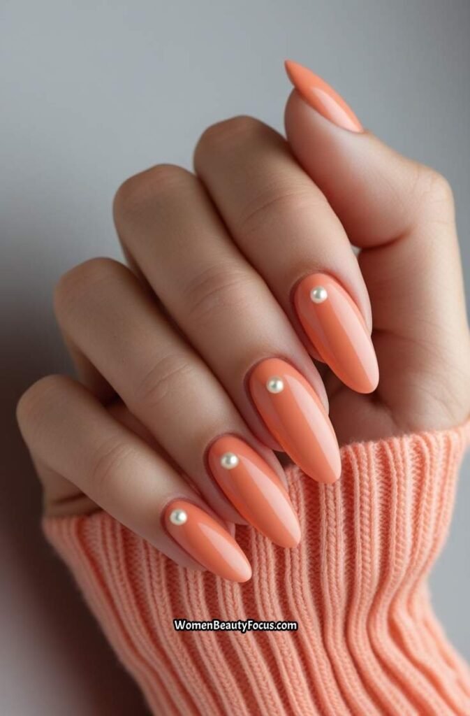 18. Soft Coral Nails with Pearl Accents