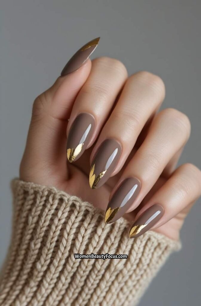 18. Warm Taupe Almond Nails with Gold Leaf