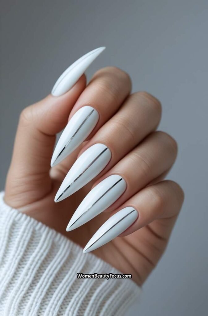 18. White Stiletto Nails with Silver Lines