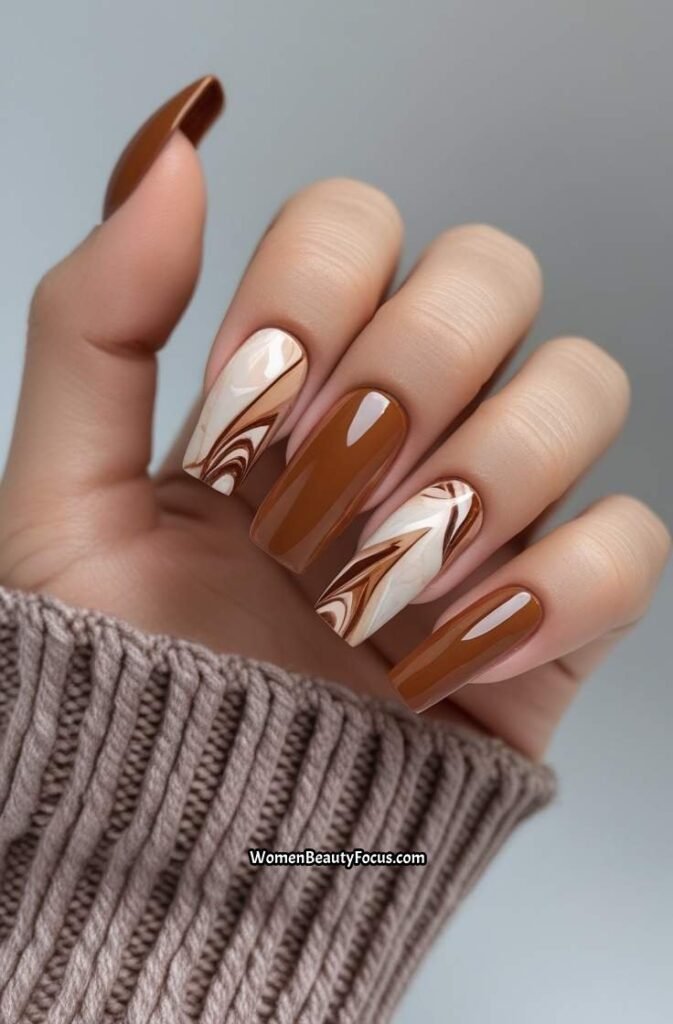19. Cinnamon Brown Nails with Subtle Marble Effect