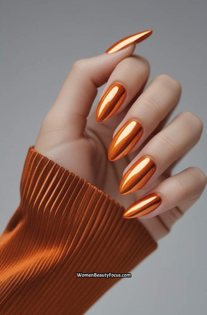19. Juicy Orange Nails with Chrome Shine 1