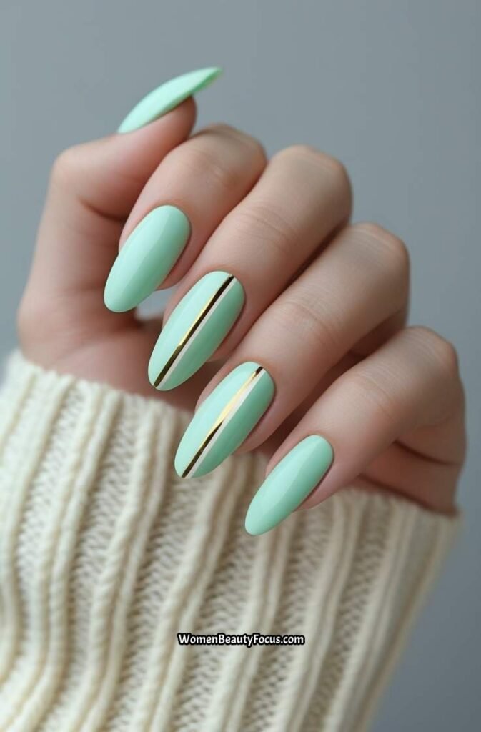 19. Light Mint Green Oval Nails with Gold Striping Tape
