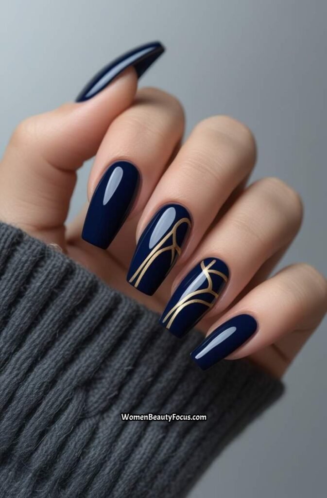 19. Navy Blue Nails with Gold Line Art
