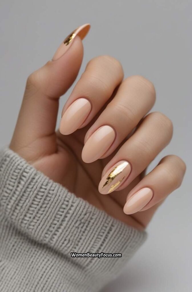 19. Soft Peachy Beige Nails with Gold Foil