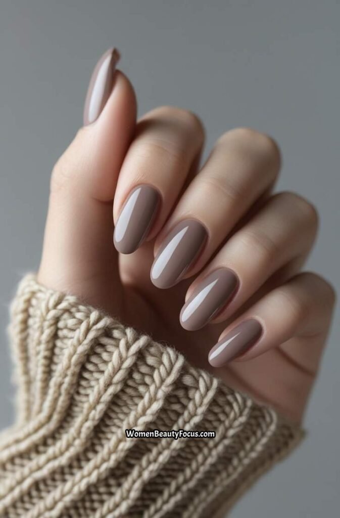 19. Soft Taupe Gel Nails with Shiny Topcoat