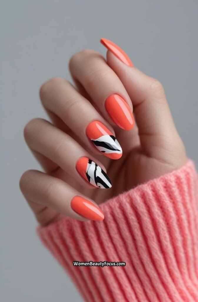 19. Vibrant Coral Nails with Bold Abstract Art