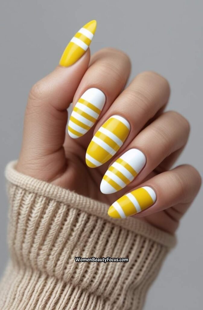 19. Yellow and White Striped Nails