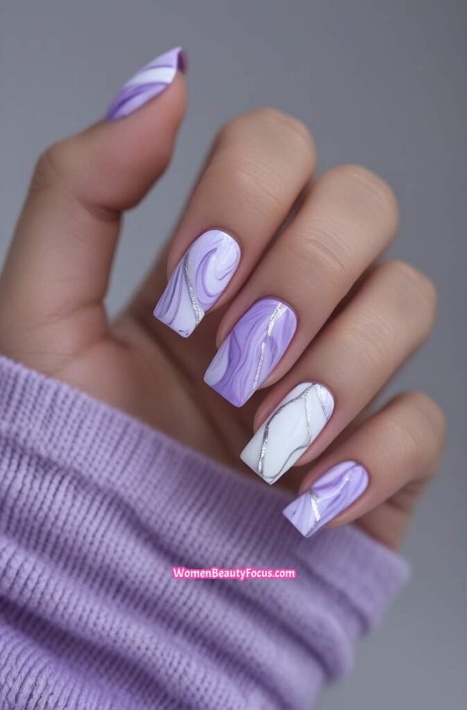 2. Lavender Marble Nails with Silver Accents