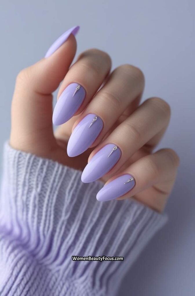 2. Light Lavender Almond Nails with Silver Accents