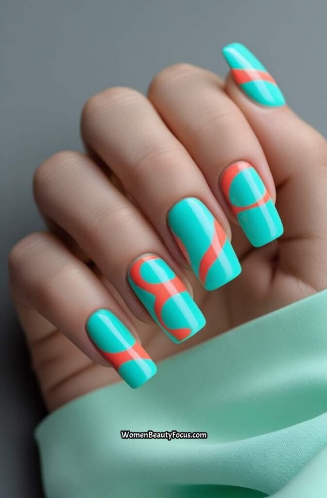 2. Turquoise and Coral Swirl Nails