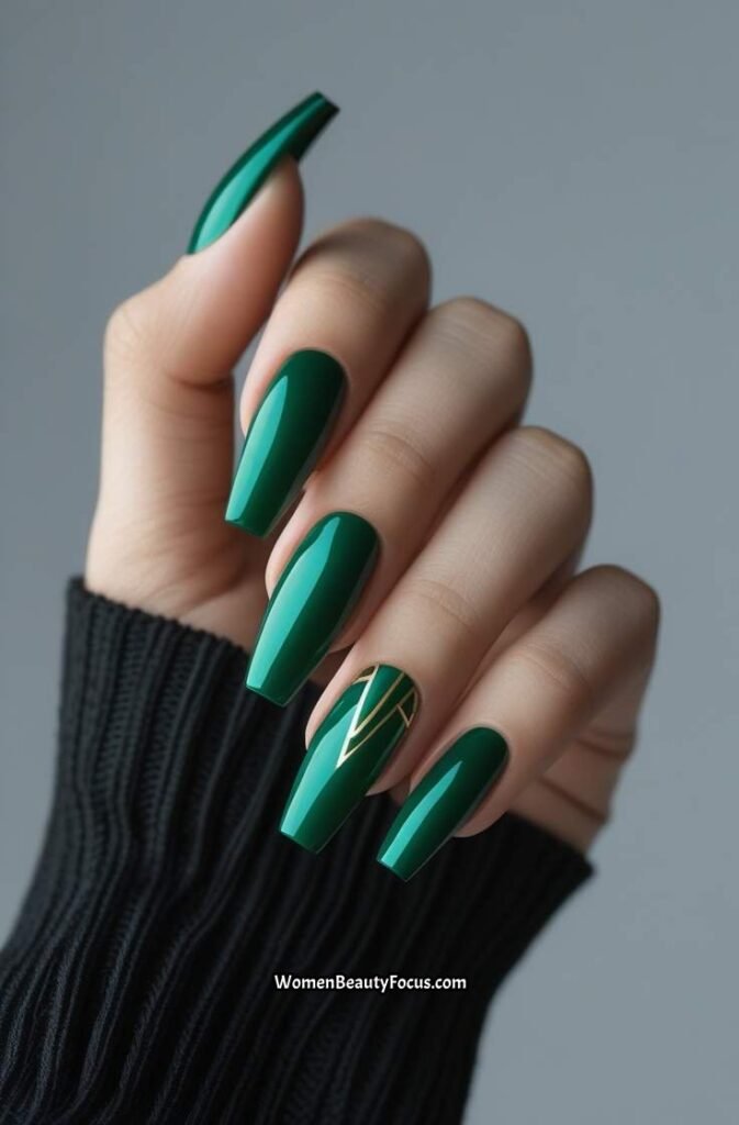 20. Emerald Green Nails with Gold Geometric Lines