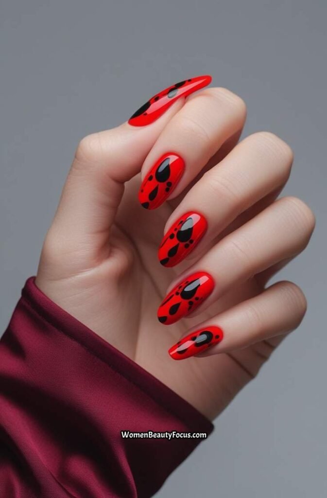 20. Fiery Red Nails with Black Accents