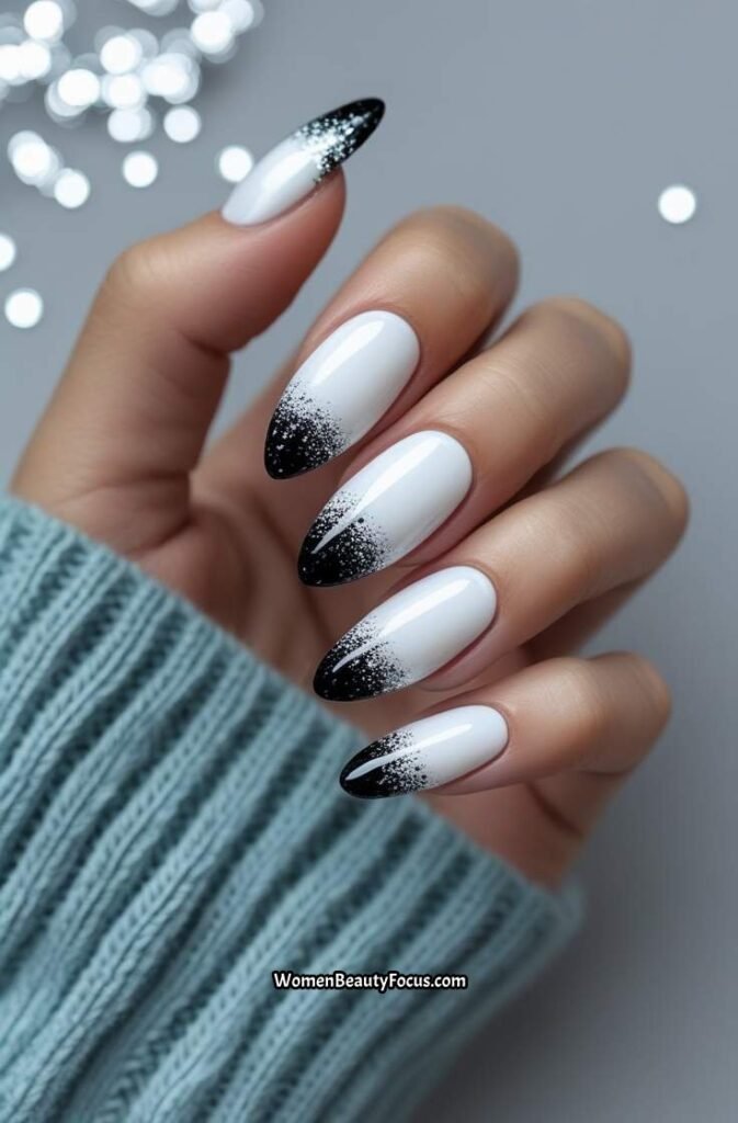 20. Glossy White Nails with Black Glitter Accents