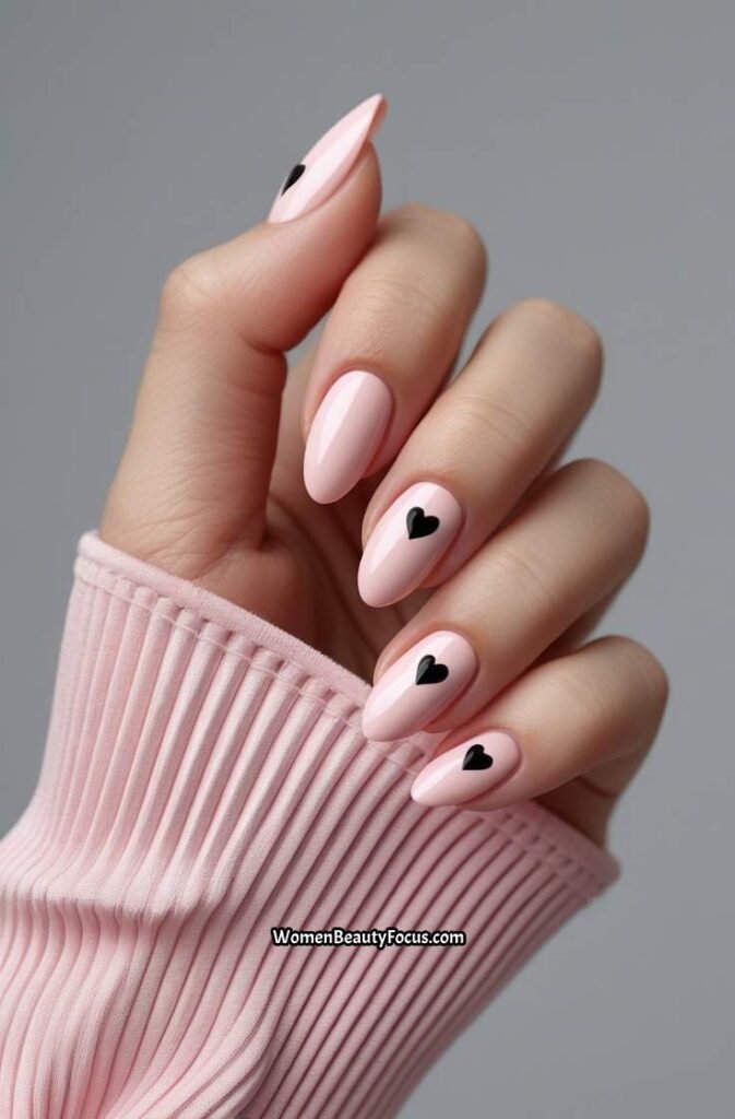 20. Pink Nails with Tiny Black Hearts