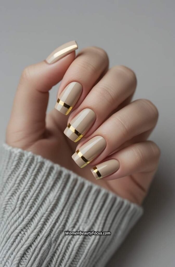 20. Soft Beige and Gold Nails