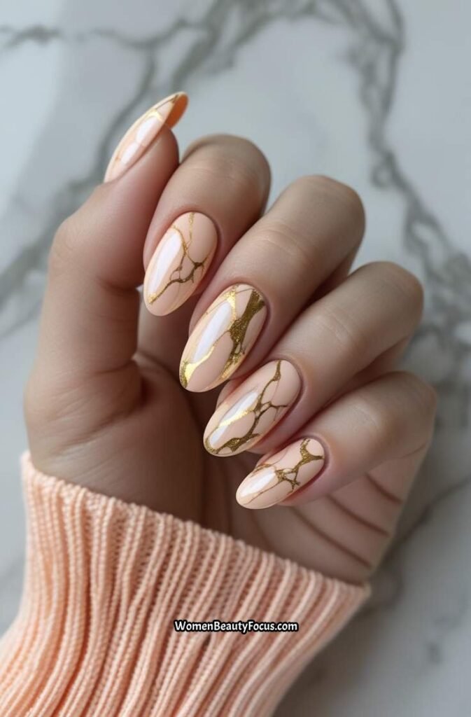 20. Soft Peach Gold Marble Nails