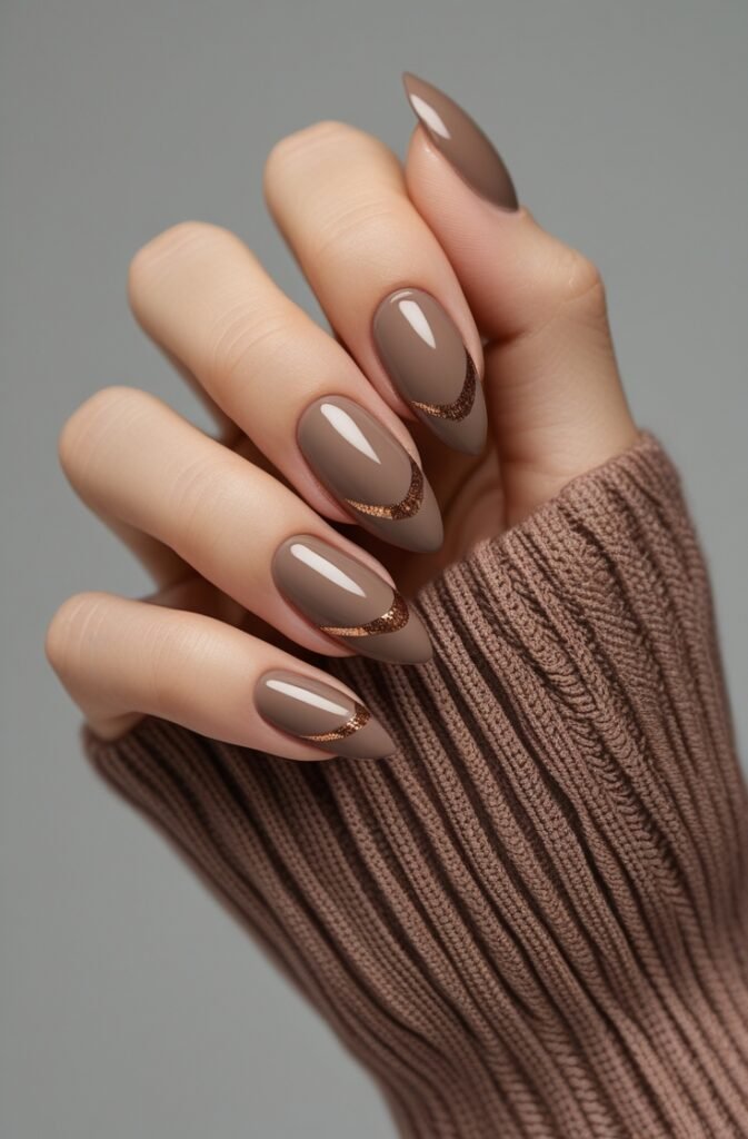 21. Almond Nails with Warm Taupe and Bronze Accents