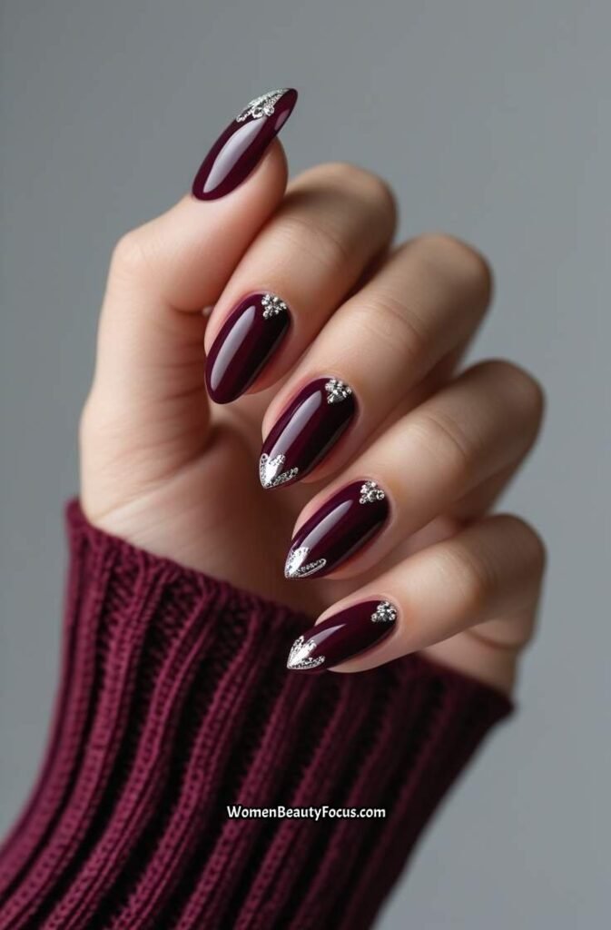 21. Elegant Burgundy Nails with Silver Detailing