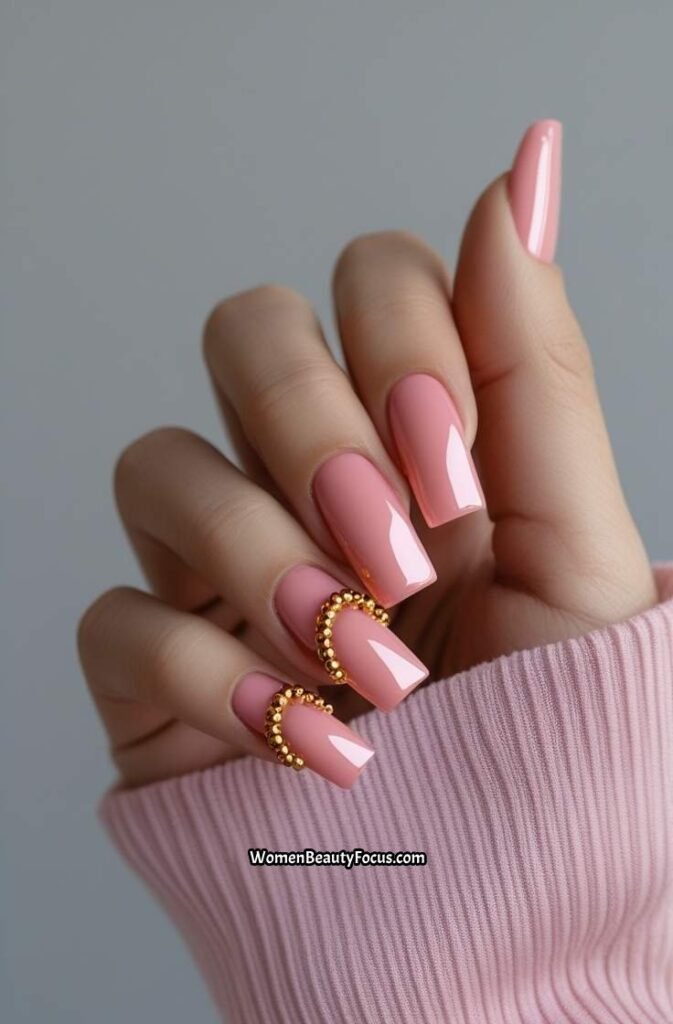 21. Glossy Pink Nails with Tiny Gold Beads