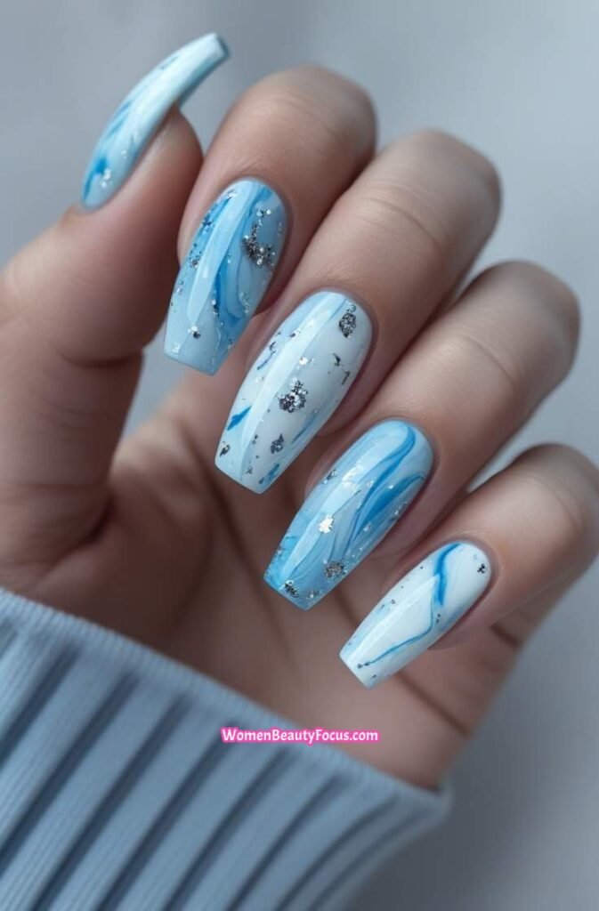 21. Icy Blue Marble Nails with Silver Flakes