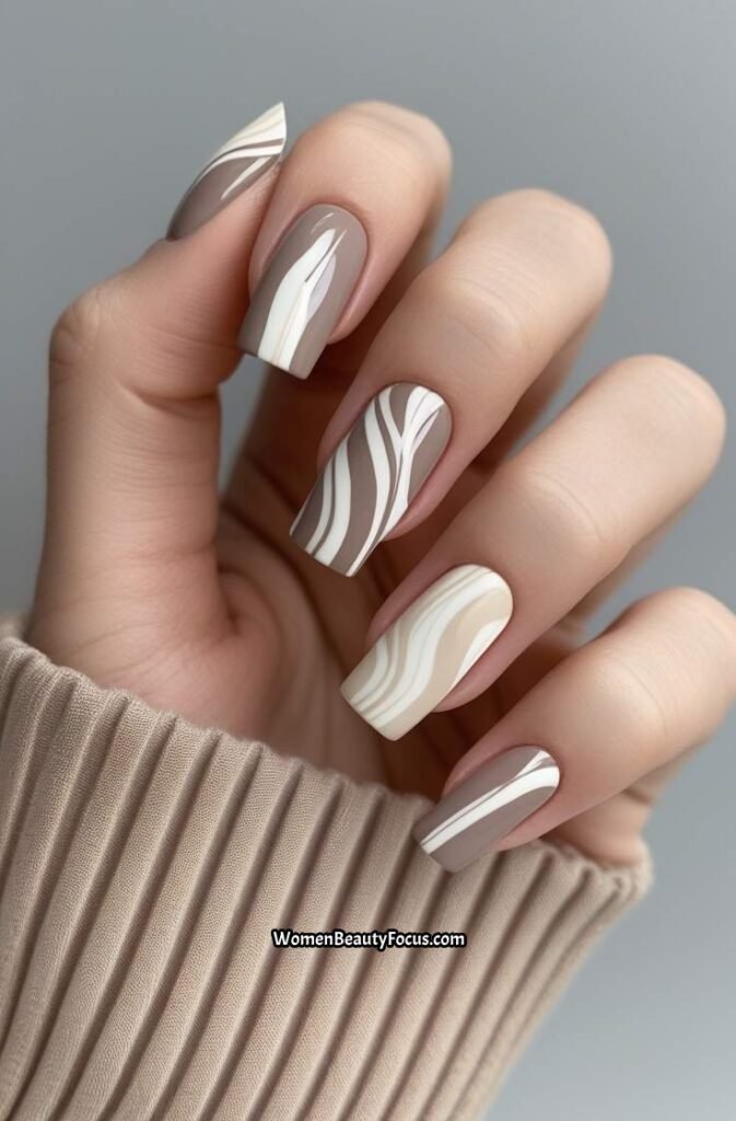 21. Neutral Swirl Gel Nails in Soft Tones