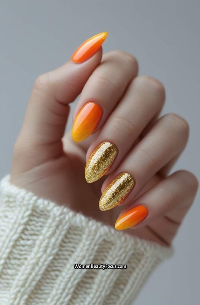 21. Orange and Gold Glitter Fade Nails