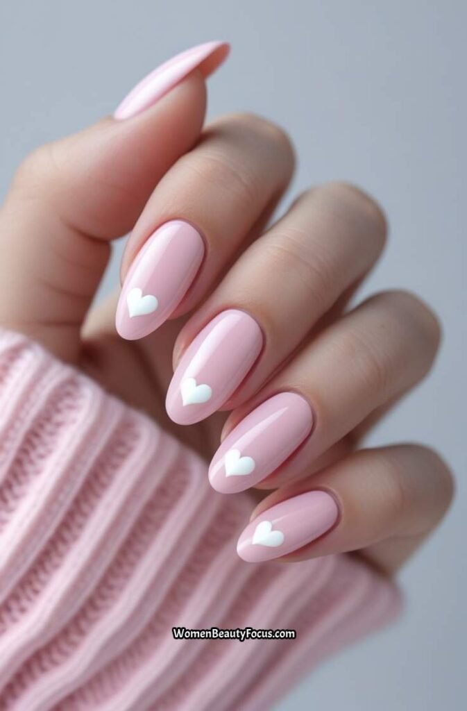 21. Pastel Pink Nails with Heart Details