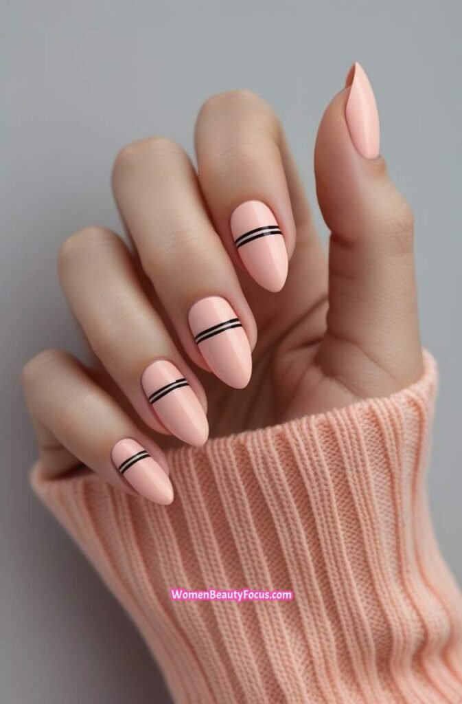 21. Peachy Pink Nails with Simple Black Lines
