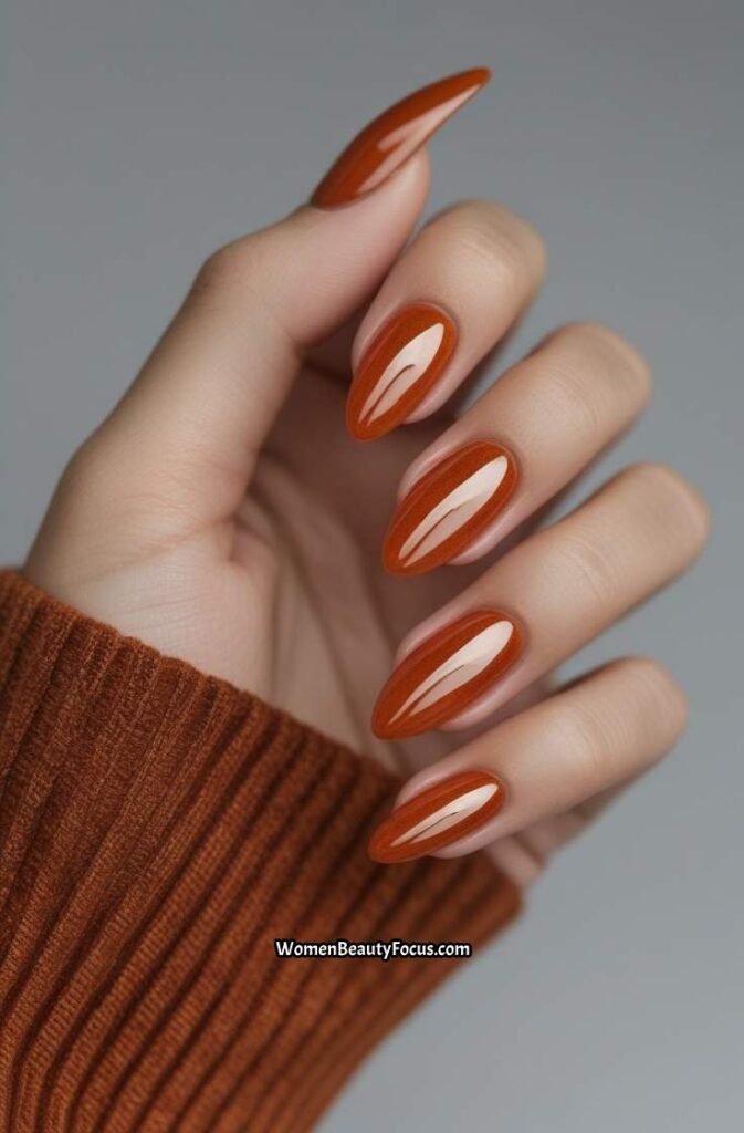 22. Burnt Orange Gel Nails with Shine