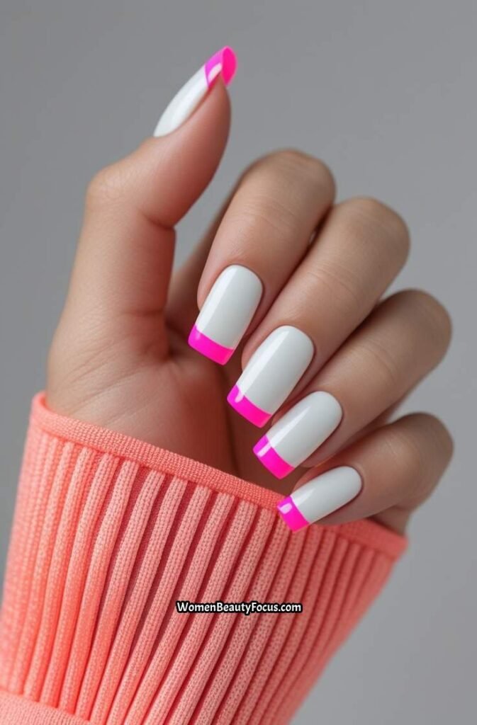 22. Classic French Tips with a Twist of Neon Pink