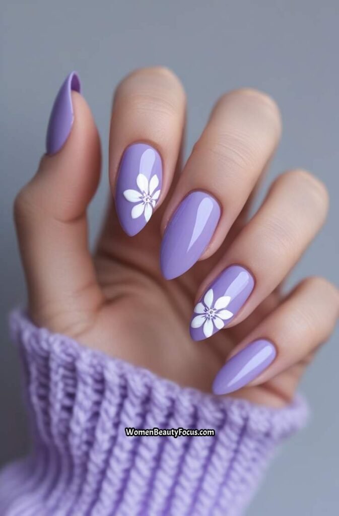 22. Lavender Almond Nails with White Floral Detail