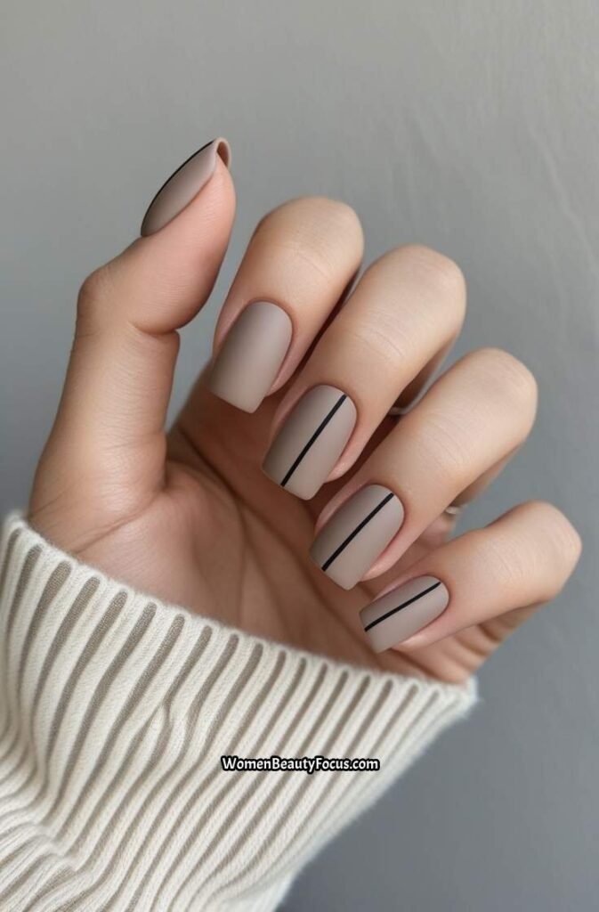 22. Neutral Taupe Nails with Minimal Black Lines