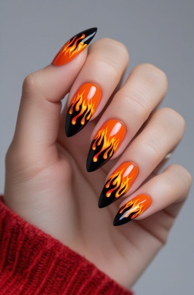 22. Orange and Black Stiletto Nails with Flames