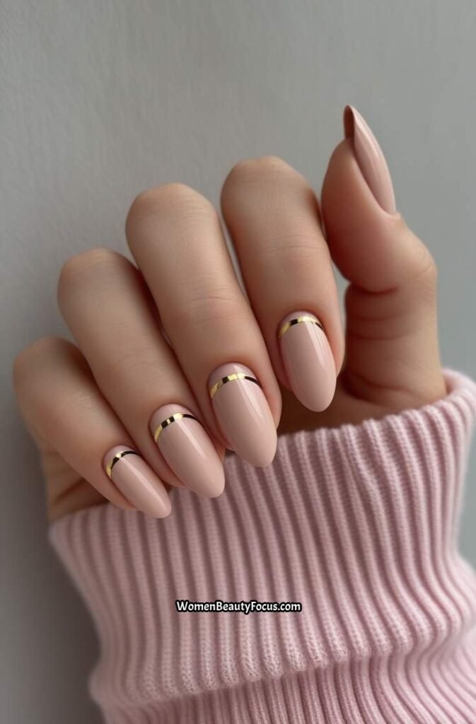 22. Rose Beige Nails with Minimal Gold Striping