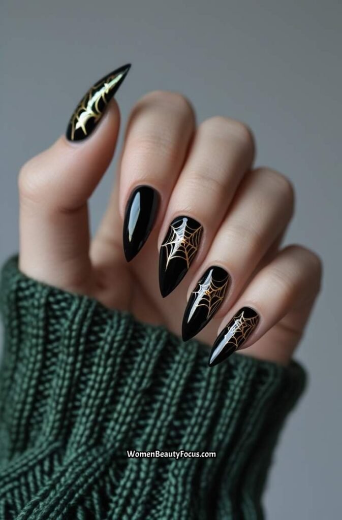 23. Black Nails with Gold Spiderweb Design