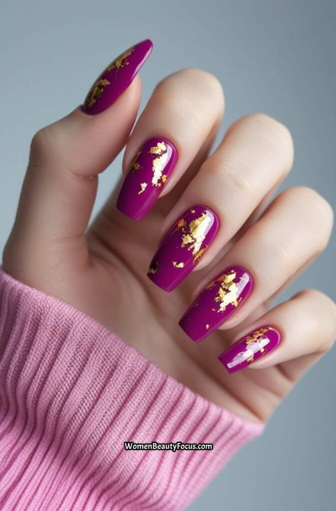 23. Bold Magenta Nails with Gold Foil Accents