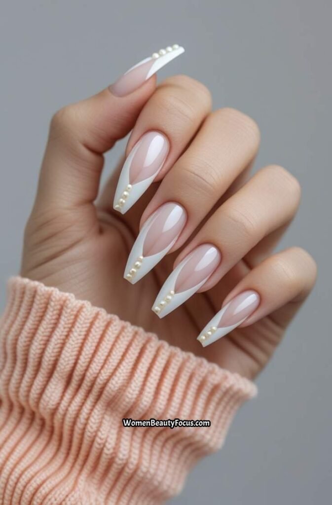 23. French Tips with Subtle Pearl Accents