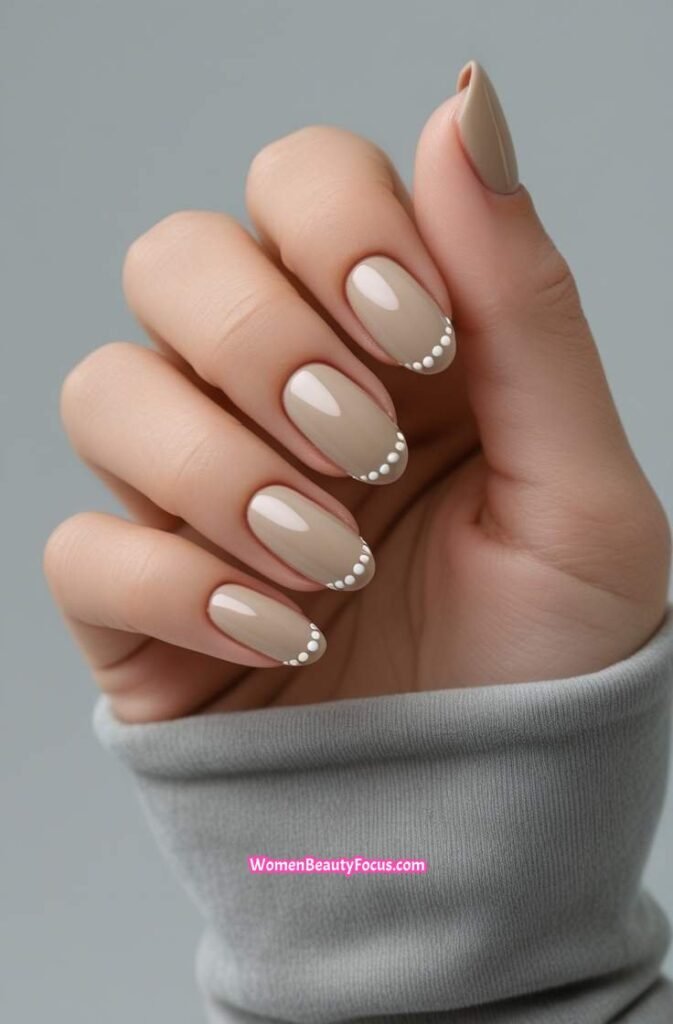 23. Glossy Neutral Nails with Micro Dot Accent