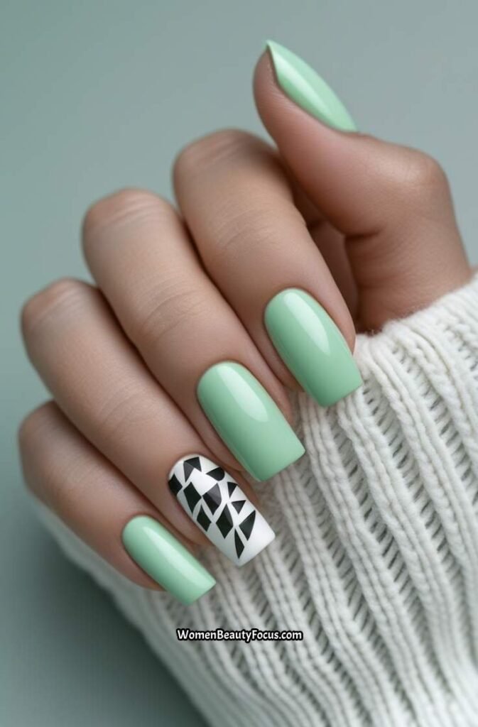 23. Mint Green Nails with White Geometric Accents