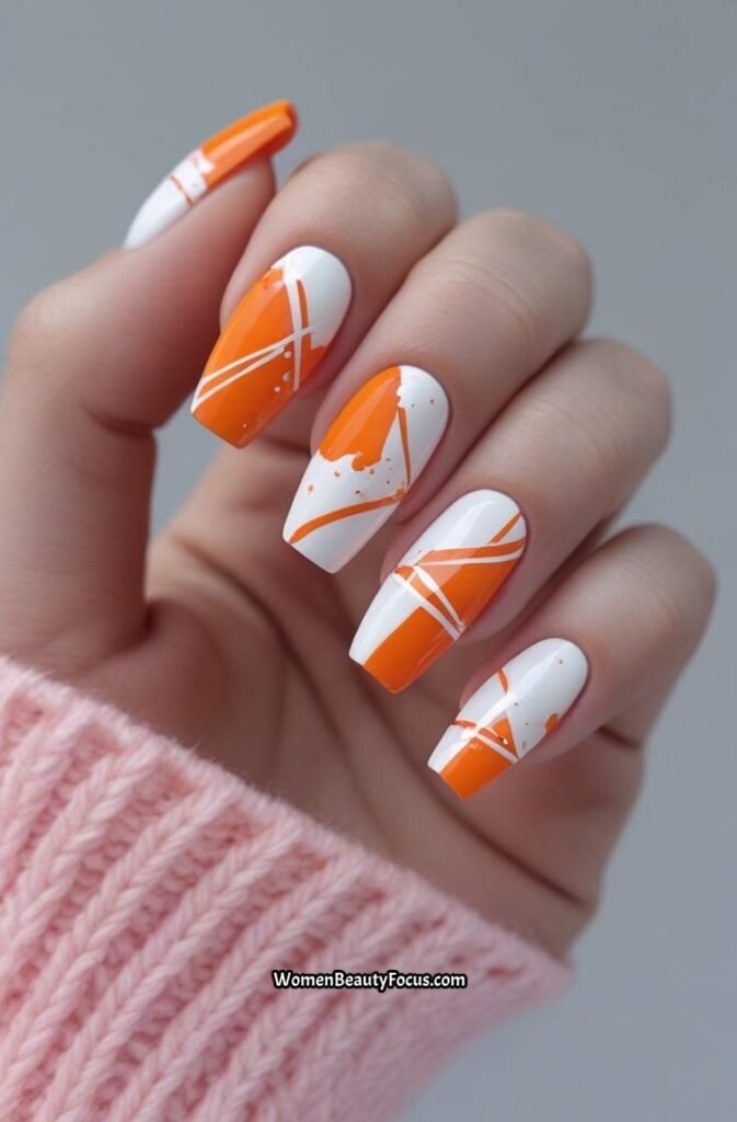 23. Orange and White Abstract Art Nails