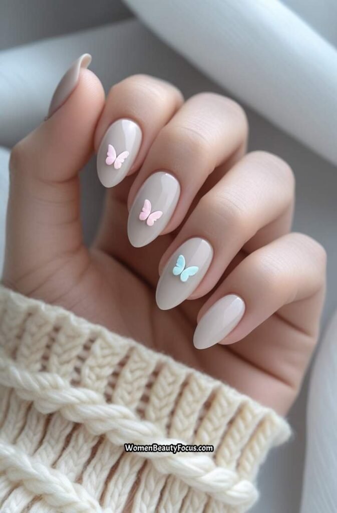 23. Soft Neutral Nails with Butterfly Accents