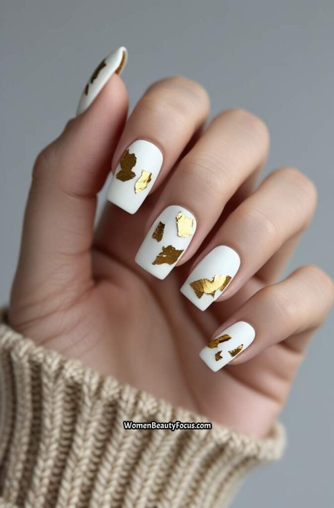 23. White Nails with Gold Leaf Flecks