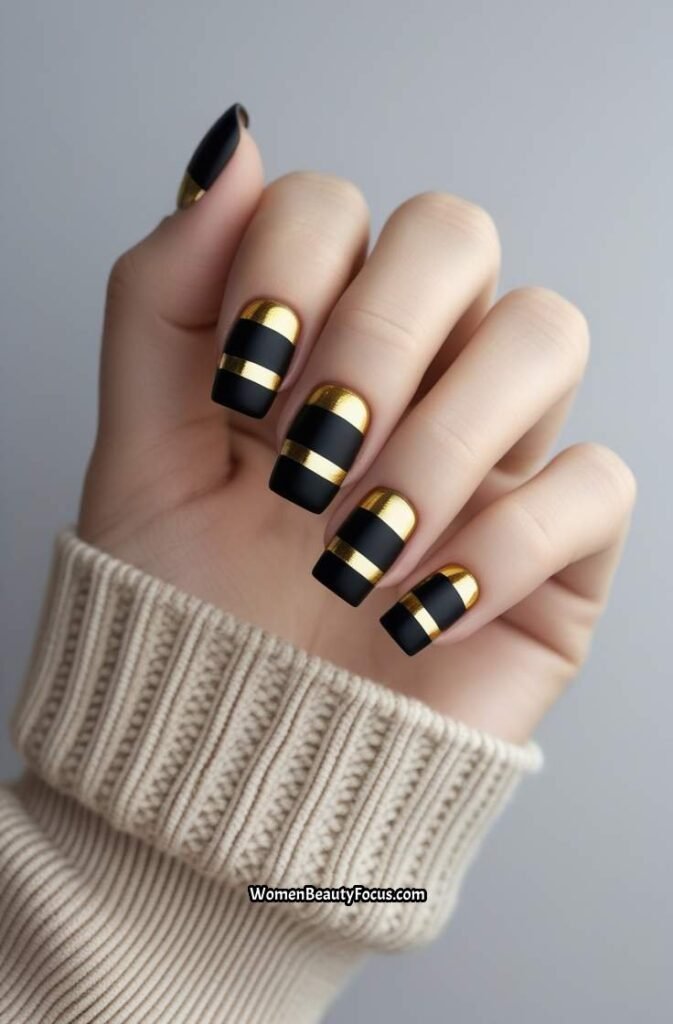 24. Black Nails with Gold Stripe and Negative Space