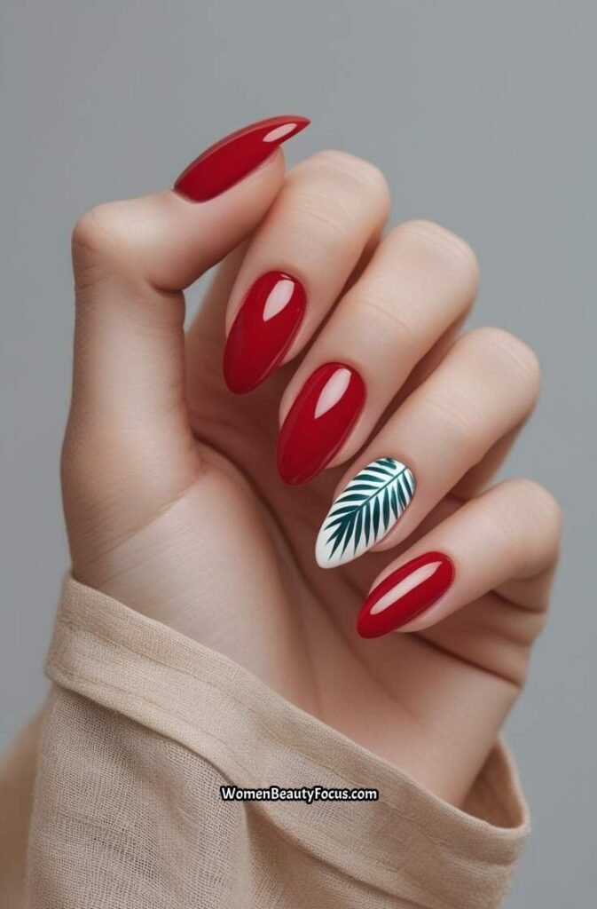 24. Glossy Red Nails with Tropical Leaf Art